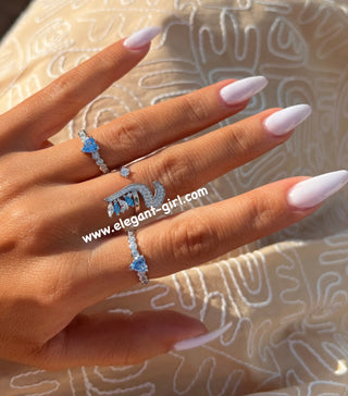 ARABIC LETTERS WHITE X AQUA MARQUISE RING