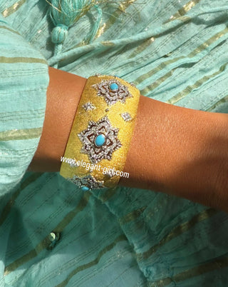 Luxury turquoise bangle worn on wrist with gold diamond design by Elegant Girl